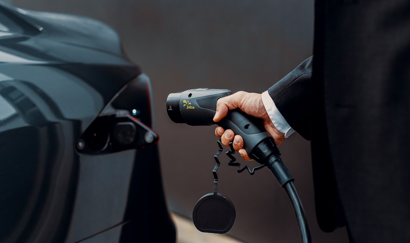 A driver charging at one of our hubs